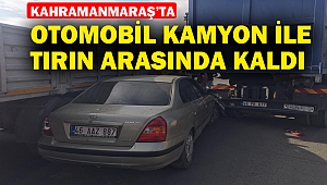 Otomobil kamyon ile tırın arasında kaldı