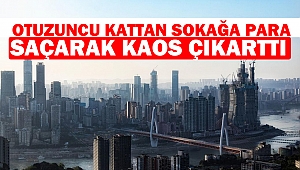 Otuzuncu kattan sokağa para saçarak kaos çıkarttı